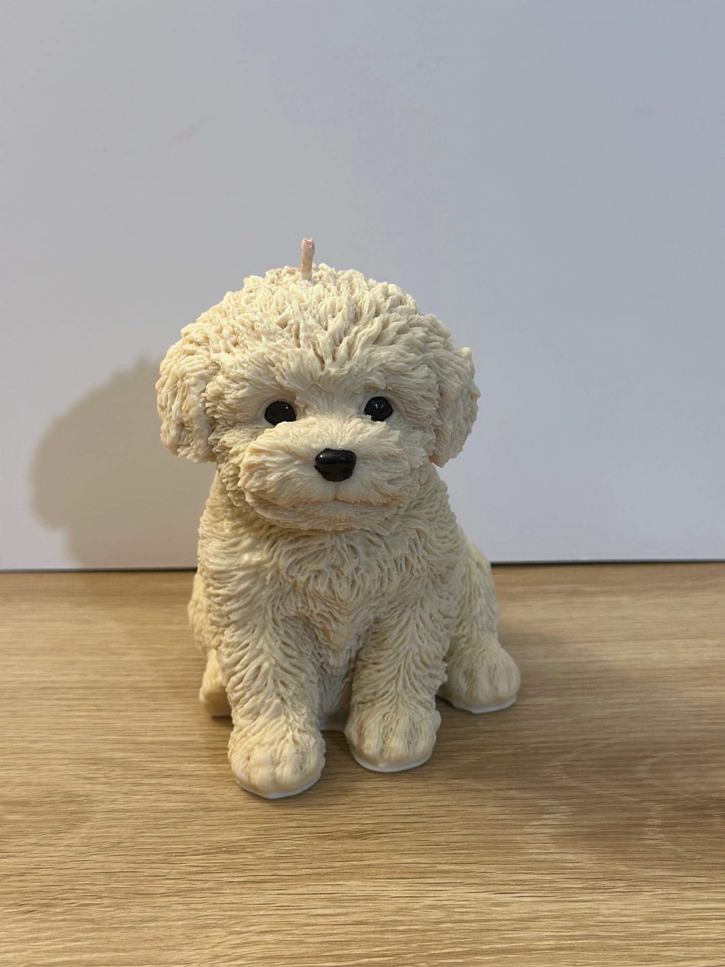 Beige puppy candle