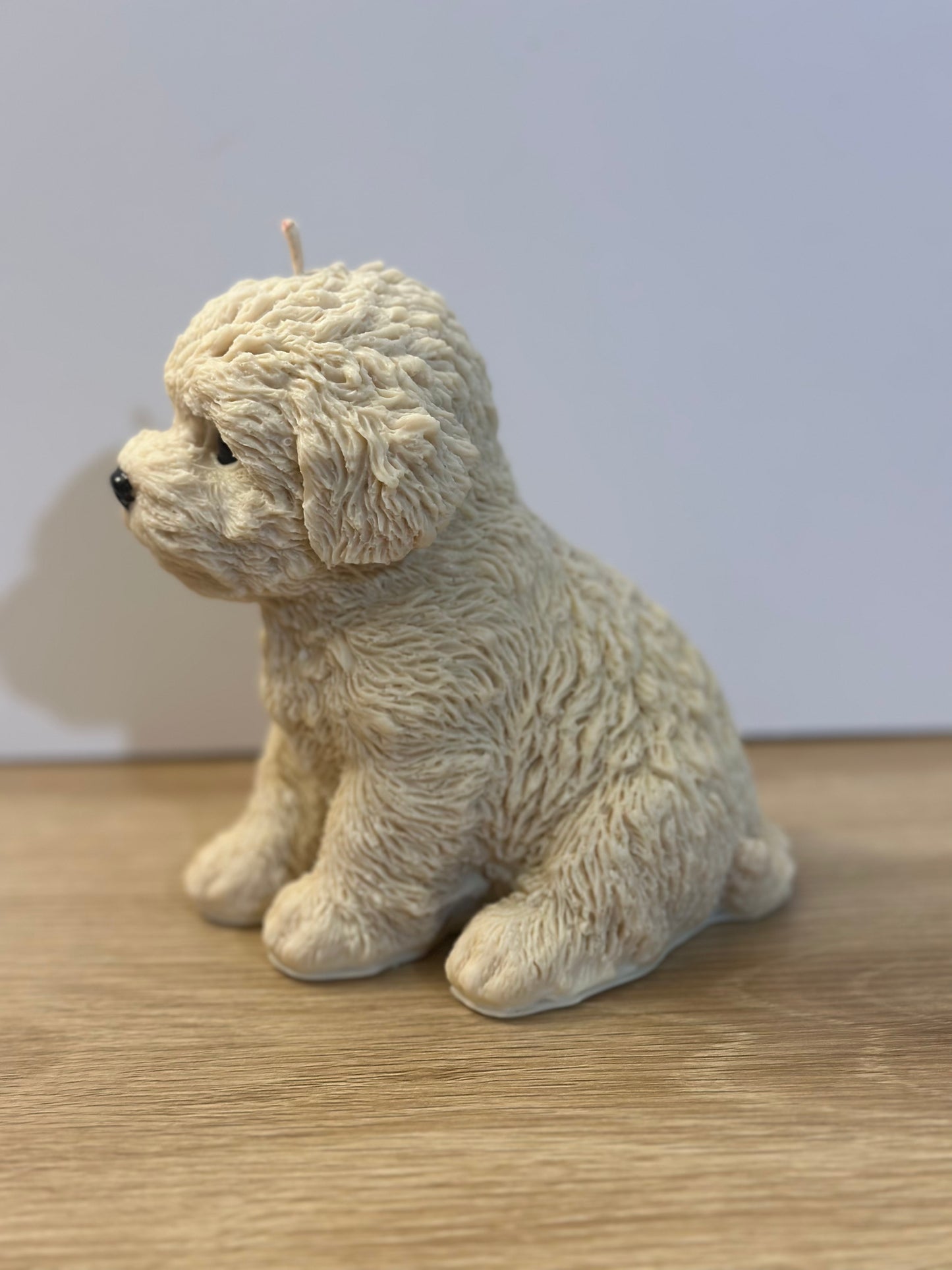 Beige puppy candle