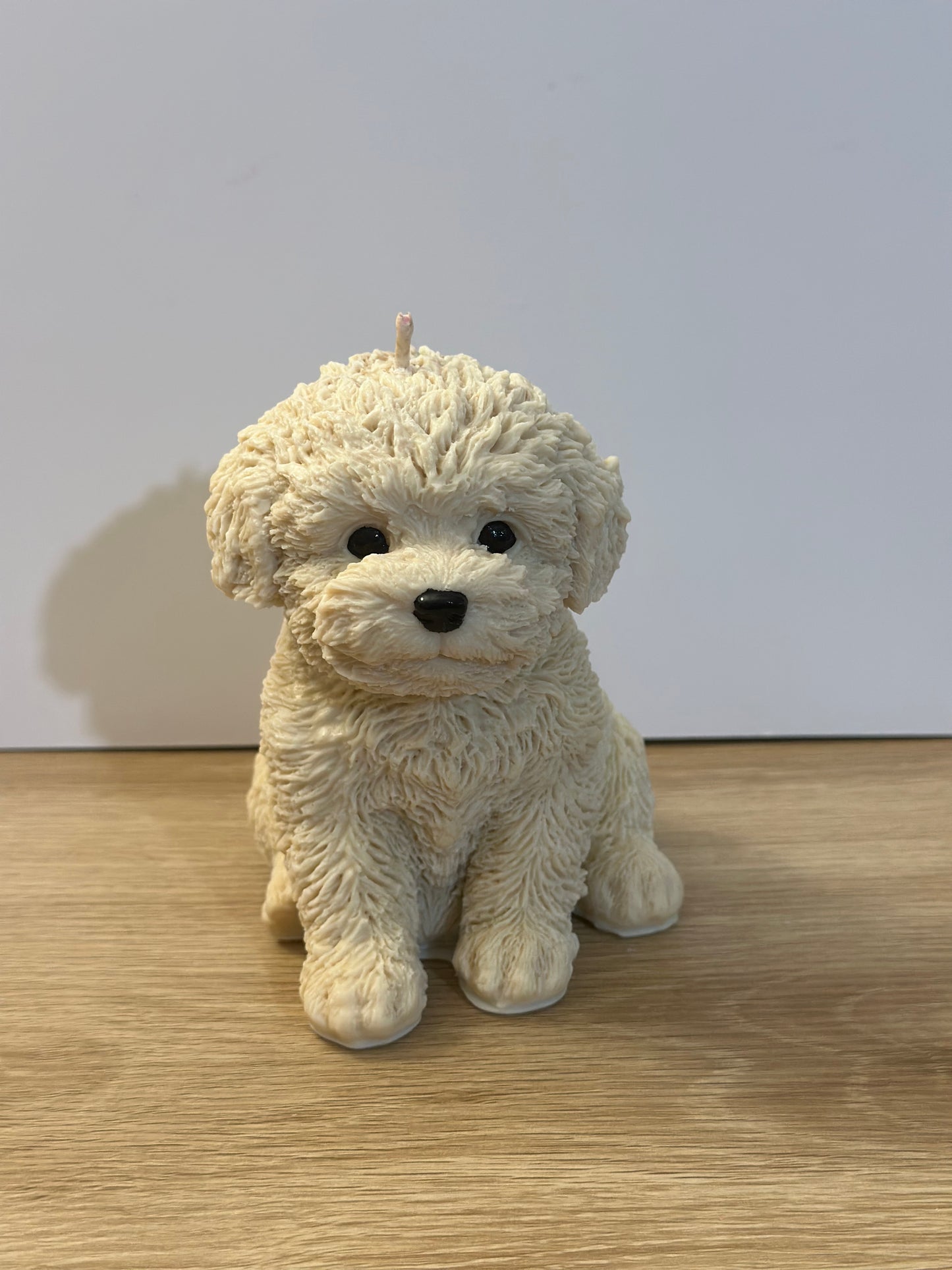 Beige puppy candle